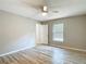 Bright bedroom featuring neutral paint, ceiling fan, and luxury vinyl plank flooring at 12043 Centralia Rd, Weeki Wachee, FL 34614