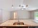 Open concept kitchen features an island, stainless steel sink, and a view of the living space at 12043 Centralia Rd, Weeki Wachee, FL 34614