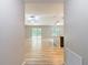 Inviting living space with wood flooring, modern lighting fixtures, and sliding glass doors to outdoor patio at 12043 Centralia Rd, Weeki Wachee, FL 34614
