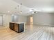 Kitchen island with a sink and open view to a living room at 12043 Centralia Rd, Weeki Wachee, FL 34614
