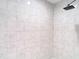 Modern shower with marble-look tile at 12043 Centralia Rd, Weeki Wachee, FL 34614