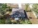 Aerial view of a well-maintained home with a lush lawn and a long driveway at 12053 Centralia Rd, Weeki Wachee, FL 34614