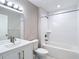Bathroom featuring a vanity with sink, a toilet, and a shower-tub combination at 12053 Centralia Rd, Weeki Wachee, FL 34614