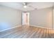 Empty bedroom with wood flooring, neutral walls, and a bright, airy atmosphere at 12053 Centralia Rd, Weeki Wachee, FL 34614