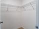Walk-in closet features white walls, wood-look floors, and a wire shelving system at 12053 Centralia Rd, Weeki Wachee, FL 34614