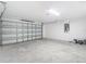 Spacious two-car garage with steel door and concrete flooring ready for customization at 12053 Centralia Rd, Weeki Wachee, FL 34614
