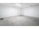Clean two-car garage with interior door, ready to park vehicles or convert to storage space at 12053 Centralia Rd, Weeki Wachee, FL 34614