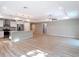 Open floorplan kitchen and living room with wood floors and tray ceiling at 12053 Centralia Rd, Weeki Wachee, FL 34614