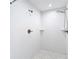 Tiled shower with dual shower heads and built-in shelving at 12053 Centralia Rd, Weeki Wachee, FL 34614