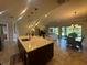 Open-concept kitchen with a large center island, pendant lighting, and stainless steel appliances at 20159 Umbria Hill Dr, Tampa, FL 33647
