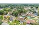 An aerial view shows a well-maintained neighborhood with mature trees and established landscaping at 625 Chilt Dr, Brandon, FL 33510