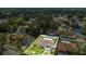 Aerial view showcasing a home's mature landscaping and a fenced backyard with a screened-in pool at 625 Chilt Dr, Brandon, FL 33510