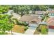 Aerial view showcasing a home with a well-maintained yard, mature trees, and a quiet neighborhood setting at 625 Chilt Dr, Brandon, FL 33510