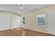 Bright bedroom featuring wood floors, a ceiling fan and double closets at 625 Chilt Dr, Brandon, FL 33510