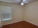 Cozy bedroom with ceiling fan and wood-look flooring at 625 Chilt Dr, Brandon, FL 33510