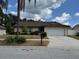 Charming single-story home featuring a well-manicured lawn and a two-car garage at 625 Chilt Dr, Brandon, FL 33510