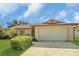 Charming single-story home with a well-manicured lawn and attached two-car garage at 625 Chilt Dr, Brandon, FL 33510