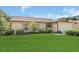 Charming single-story home with a well-manicured lawn and attached two-car garage at 625 Chilt Dr, Brandon, FL 33510