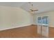 Bright living room with wood floors and sliding glass doors to the pool at 625 Chilt Dr, Brandon, FL 33510