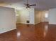 Open-concept living area featuring hardwood floors and neutral paint tones at 625 Chilt Dr, Brandon, FL 33510