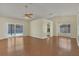 Open-concept living room with wood floors and easy access to the kitchen and lanai at 625 Chilt Dr, Brandon, FL 33510