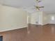 Open-concept living room with sleek wood floors and neutral walls at 625 Chilt Dr, Brandon, FL 33510