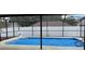 Enclosed pool featuring a blue tarp covering the surface of the water at 625 Chilt Dr, Brandon, FL 33510