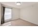 Carpeted bedroom featuring a large window, and a ceiling light at 727 Vineyard Reserve Ct, Seffner, FL 33584