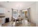 Cozy dining area with neutral decor, a dining table set for six, and ample natural light at 727 Vineyard Reserve Ct, Seffner, FL 33584