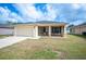 Charming one-story home featuring a two-car garage, well-maintained lawn, and a screened-in front porch at 727 Vineyard Reserve Ct, Seffner, FL 33584