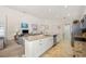 Open kitchen concept with granite counters, island with sink, stainless appliances overlooking the living area at 727 Vineyard Reserve Ct, Seffner, FL 33584
