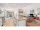 Spacious kitchen with a long island and granite countertops, open to the Gathering room and dining area at 727 Vineyard Reserve Ct, Seffner, FL 33584