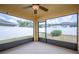 Enclosed lanai with screened windows and door offering views of the fenced backyard at 727 Vineyard Reserve Ct, Seffner, FL 33584