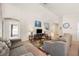 Spacious living room with neutral tones and comfortable seating arrangement, creating a welcoming atmosphere at 727 Vineyard Reserve Ct, Seffner, FL 33584