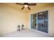 Covered patio with sliding glass door to the interior and quaint ornamental plants at 727 Vineyard Reserve Ct, Seffner, FL 33584