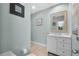 Stylish bathroom with a marble countertop vanity and warm color scheme at 7313 Crape Myrtle Way, Sarasota, FL 34241