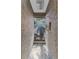Modern shower stall with stone walls and multiple shower heads for a luxurious experience at 7313 Crape Myrtle Way, Sarasota, FL 34241