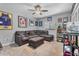 Spacious bedroom featuring carpet floors, ceiling fan, and sports memorabilia decorations at 7313 Crape Myrtle Way, Sarasota, FL 34241