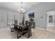 Stylish dining room with hardwood floors, modern lighting, and tasteful decor at 7313 Crape Myrtle Way, Sarasota, FL 34241