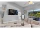 Inviting living room with a view of outdoor pool area and lots of space at 7313 Crape Myrtle Way, Sarasota, FL 34241