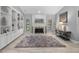 Cozy living room with a stone fireplace, built-in shelving, and neutral decor at 7313 Crape Myrtle Way, Sarasota, FL 34241