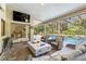 Relax on this lanai with a seating area, fire pit and a view of the pool at 7313 Crape Myrtle Way, Sarasota, FL 34241