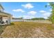 Expansive backyard with a lush lawn, perfect for outdoor activities and enjoyment at 12214 Citrus Leaf Dr, Gibsonton, FL 33534