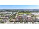 Aerial view of a neighborhood with house, showcasing lush greenery, community ponds, and landscaping at 1401 Parker Den Dr, Ruskin, FL 33570