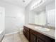 Bathroom with granite sink counter with matching cabinets at 1401 Parker Den Dr, Ruskin, FL 33570