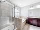 This bathroom has a walk-in shower and a tub at 1401 Parker Den Dr, Ruskin, FL 33570