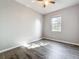 Bright bedroom with a ceiling fan, a window and hardwood floors at 1401 Parker Den Dr, Ruskin, FL 33570
