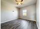 Bedroom with ceiling fan and hardwood floors is freshly painted at 1401 Parker Den Dr, Ruskin, FL 33570