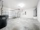 A garage with a garage door and space for storage at 1401 Parker Den Dr, Ruskin, FL 33570