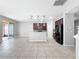 Spacious kitchen with modern dark wood cabinetry, stainless steel appliances, and an open layout perfect for entertaining at 1401 Parker Den Dr, Ruskin, FL 33570